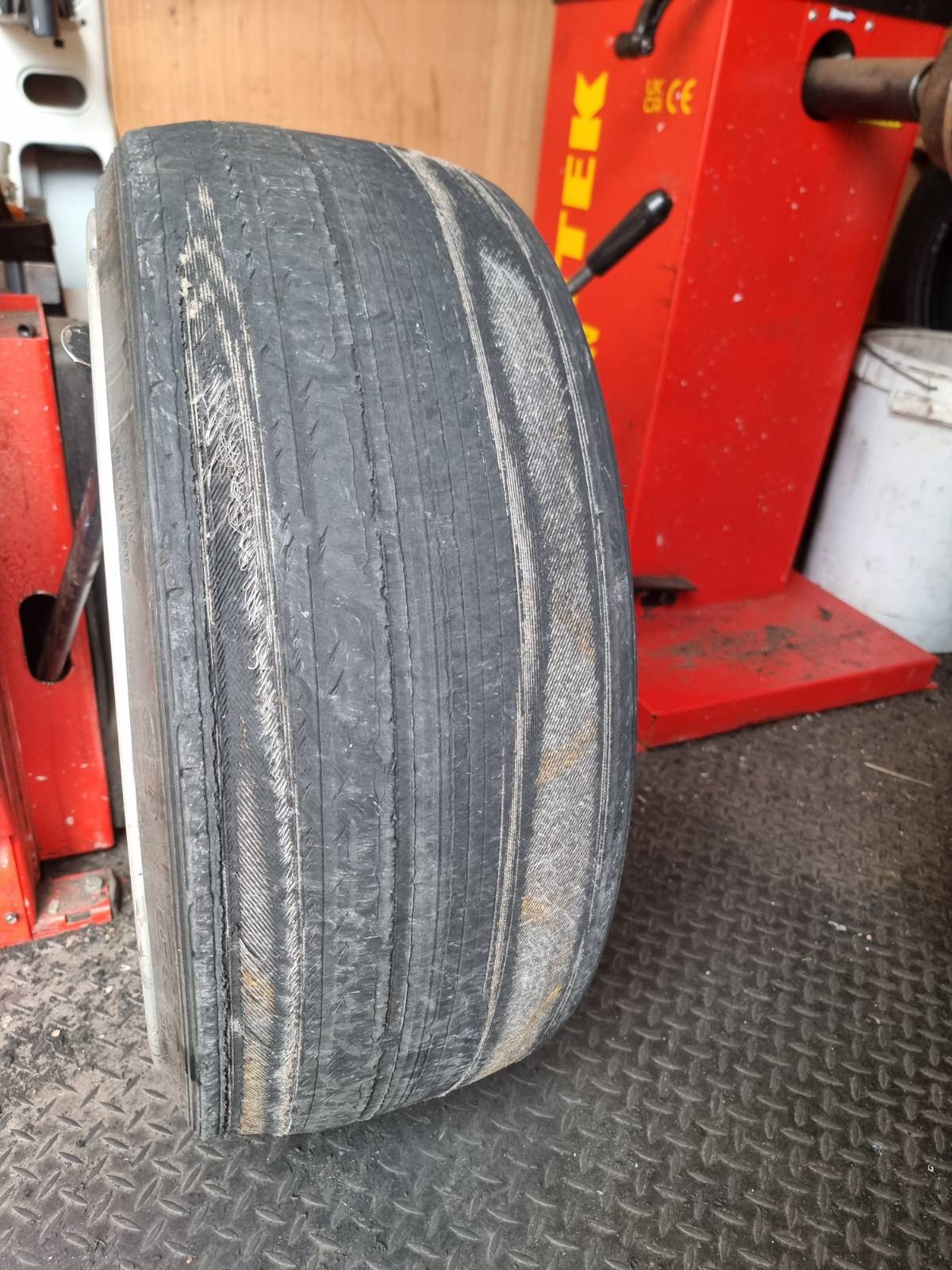 A severely worn tyre with the tread completely worn down